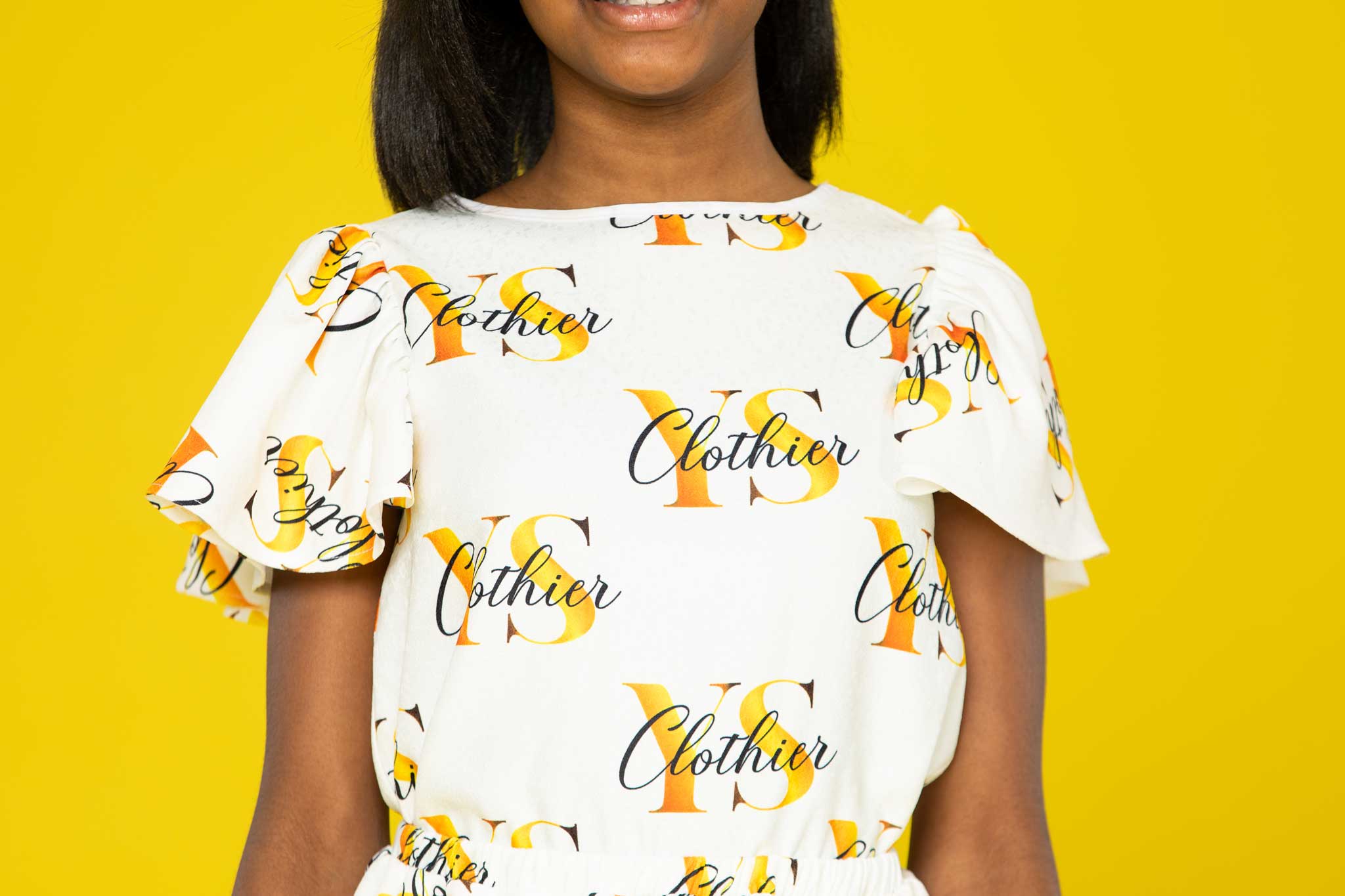 Lexi Letter Print Ruffled Short Sleeve Top